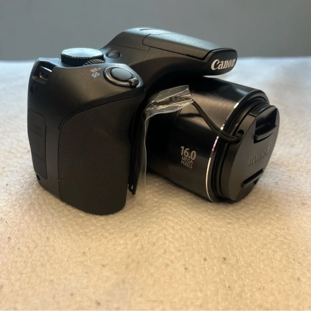 Canon Black Digital Camera with Large Zoom Lens and Textured Grip